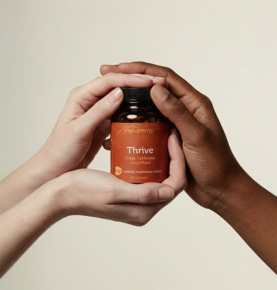 three hands are holding mushroom supplement bottle