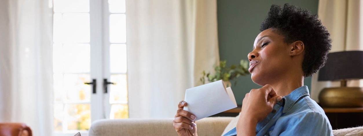 Menopausal Mature Woman Having Hot Flush 